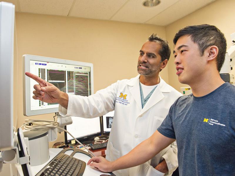 Student works with faculty in neurology lab