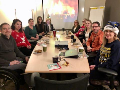 Group photo featuring the Michigan Spinal Cord Injury System staff during their 2019 Holiday party