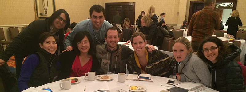 Family Medicine residents gathered around a table. 