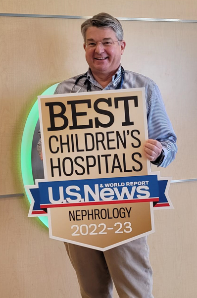 Dr. Kershaw holding a U.S. News and World Report Nephrology Sign