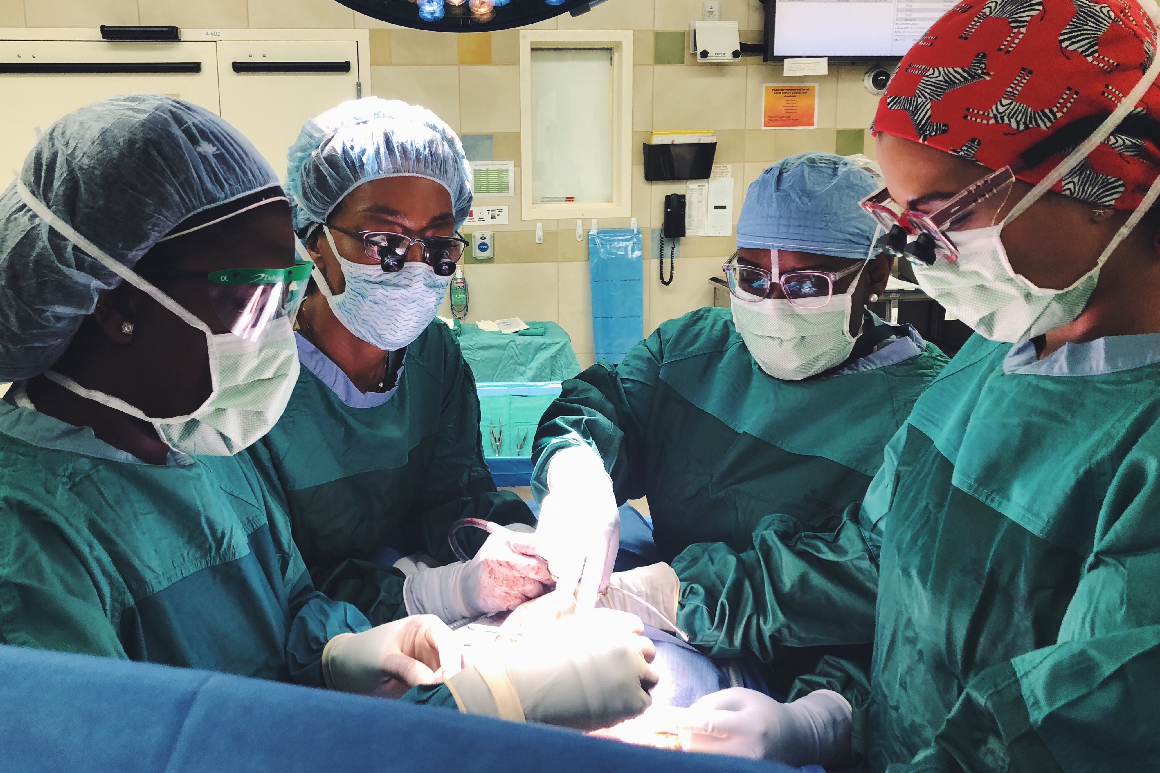 Christa Grant, Erika Newman, Shannon Fayson, and Valeria Valbuena in the operating room 