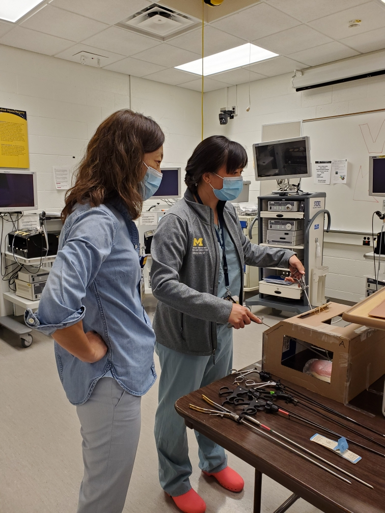Drs. Grace Kim and Courtney Lim testing a laparoscopy simulator prototype
