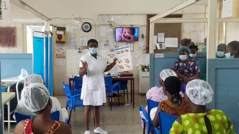 A nurse providing postnatal education at the hospital