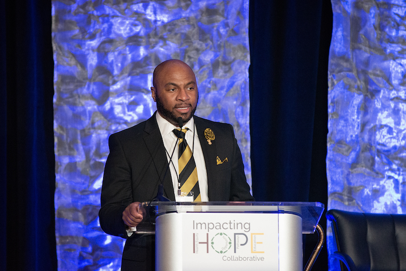 Michael Johnson speaking at the 2023 HOPE Symposium
