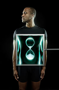 Graphic showing a man with a monitor displaying an hourglass