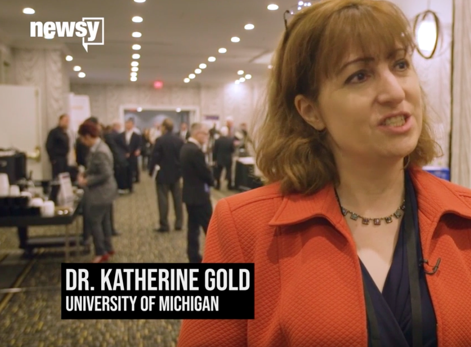 A screen capture of Dr. Katherine Gold speaking in the video. A Newsy logo appears in the top left corner. 