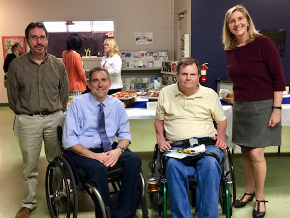 Group photo of Dr. Tate, Marty Forcheimer, and researchers from the Disability Network Washtenaw Monroe Livingston