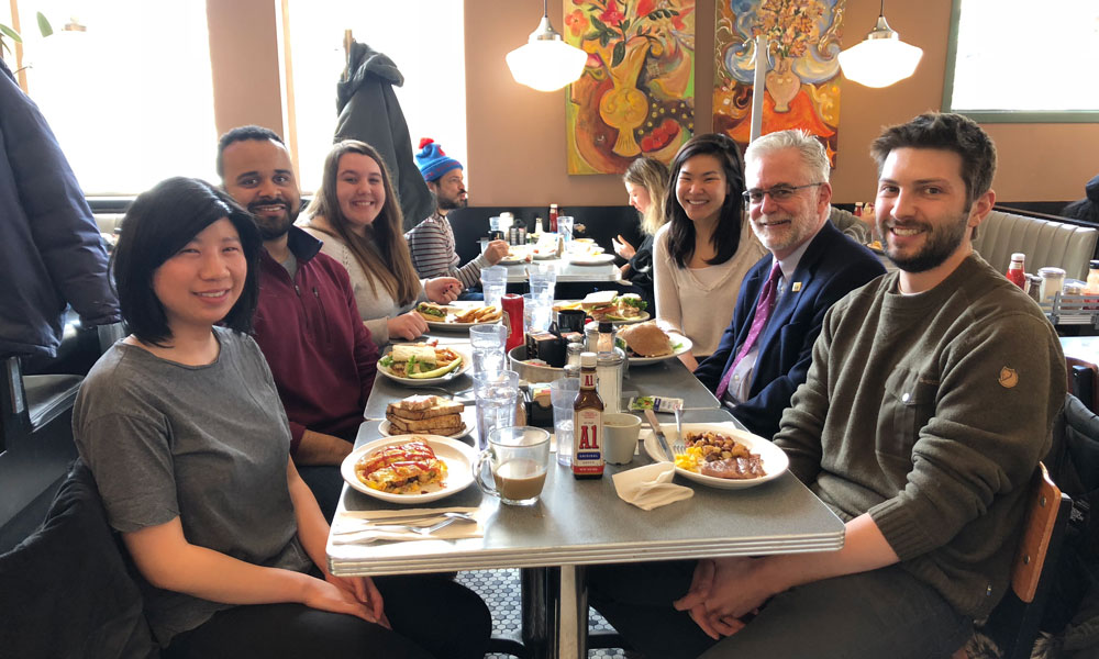 Immunology trainees at lunch with Dr. Bernard Fox