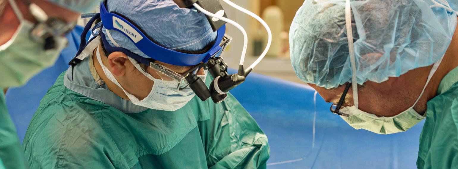 Dr. Tang and team members in the operating room