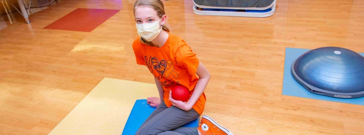 Maggie Eggleston, a teen diagnosed with FSHD1 during one of her PT appointments.