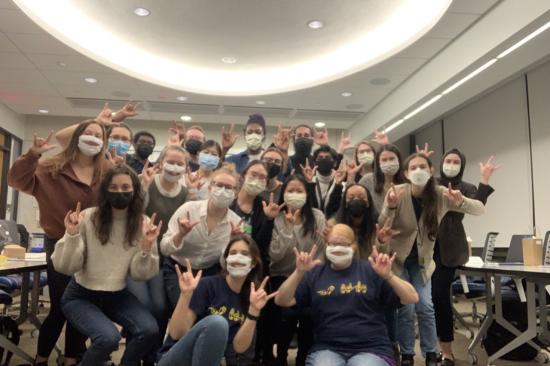 First-year medical students with the University of Michigan Medical School sign the message 'I Love You' in a classroom in the Taubman Health Sciences Library