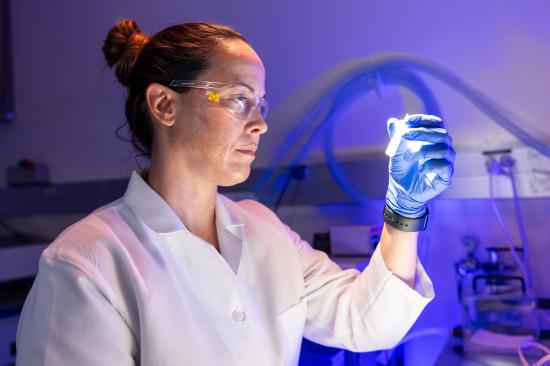 Lab member examining sample in the Conrad Jobst Vascular Research Laboratories