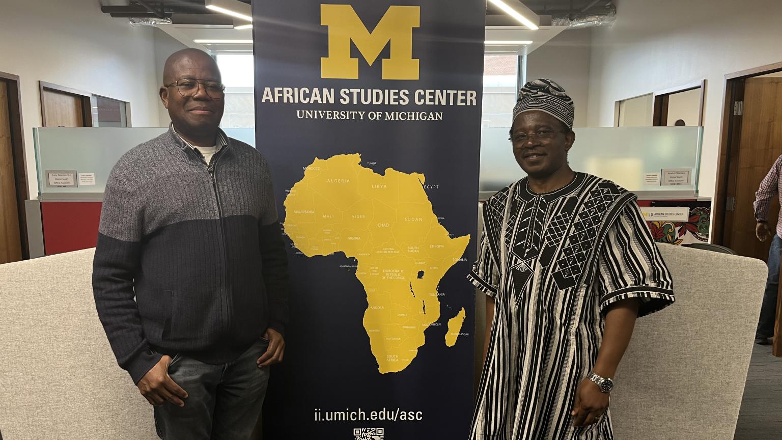 photo of Omolade Adunbi, Ph.D., M.Phil., M.A., Director Academic Programs at the Africa Studies Center and Dr. Njamnshi
