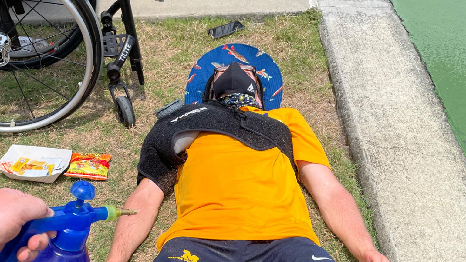 A tennis player cools down while icing his shoulder. 