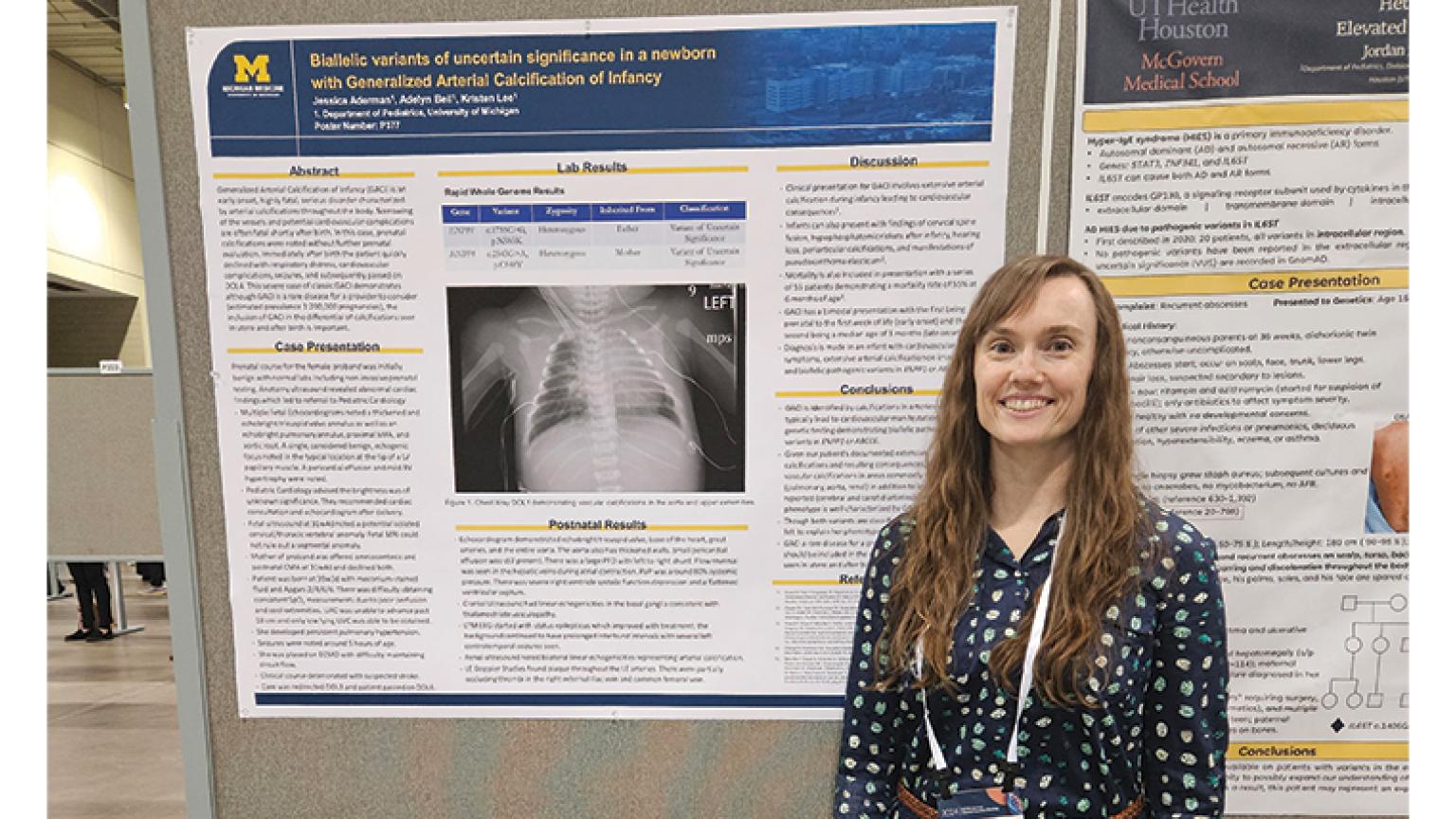 Jessica Aderman MD posing with her research poster at the American College of Medical Genetics Conference.