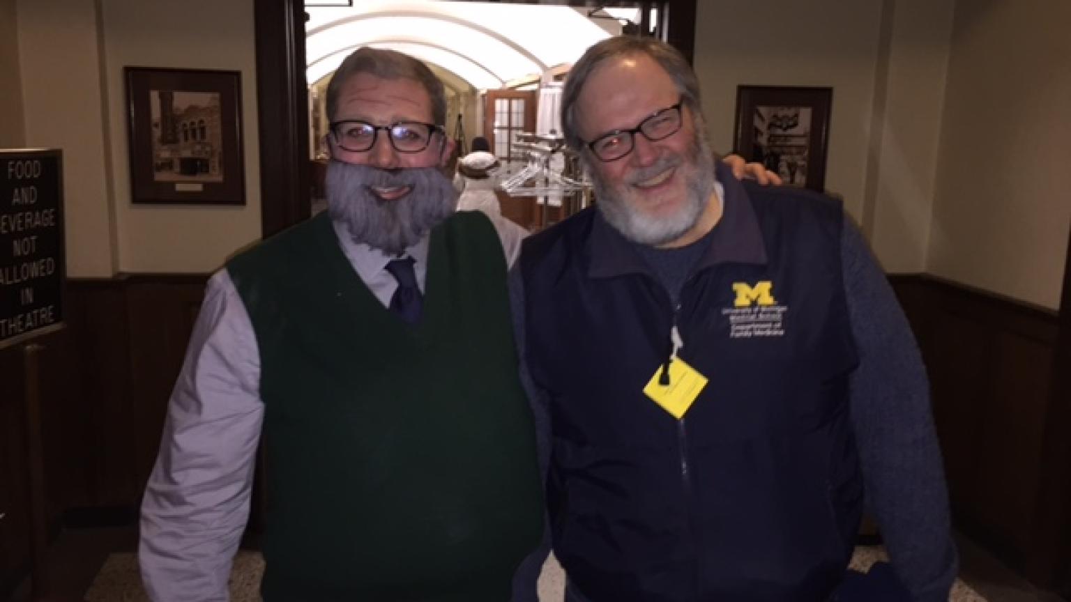 Kent with a student who is dressed up as Kent wearing a fake beard and padded sweater vest