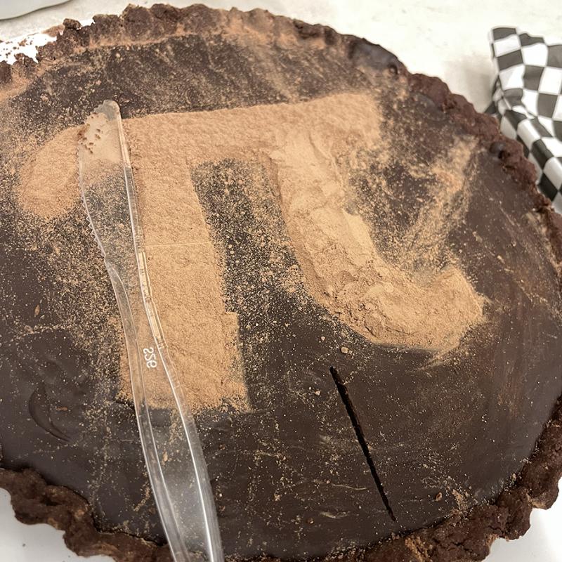 Truffle chocolate desert with pi symbol made with powdered chocolate