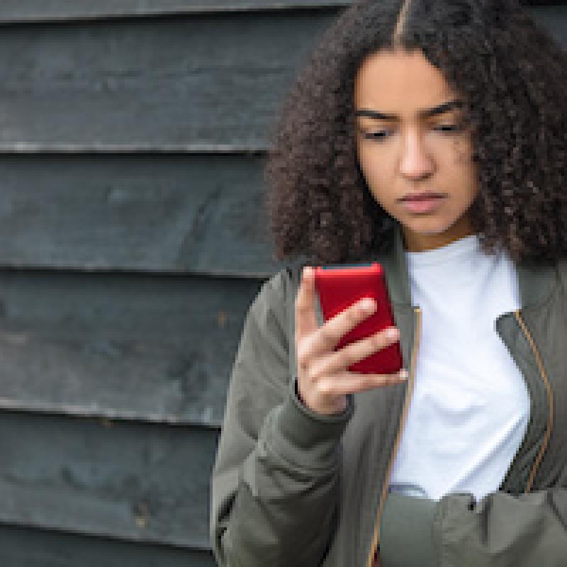 young woman looking at cell phone