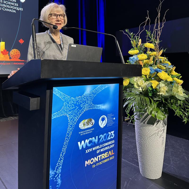a photo of Dr. Eva Feldman presenting at the 26th World Congress of Neurology