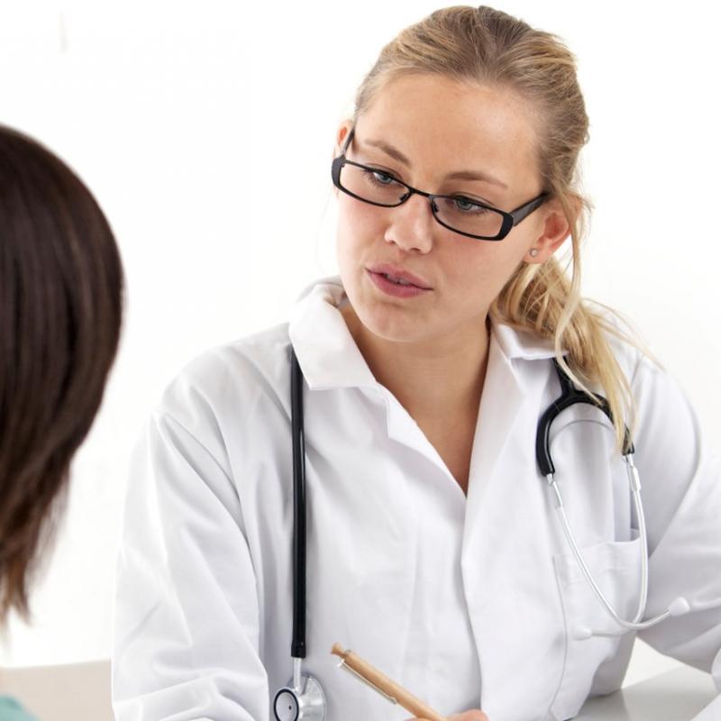 Young patient private discussion with doctor