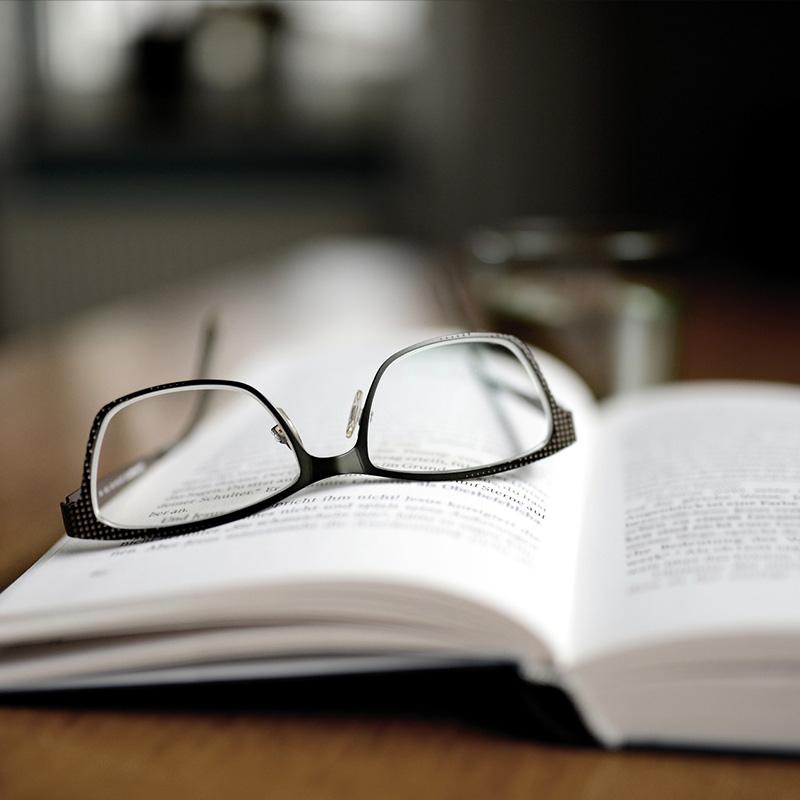 Image of glasses sitting on a book