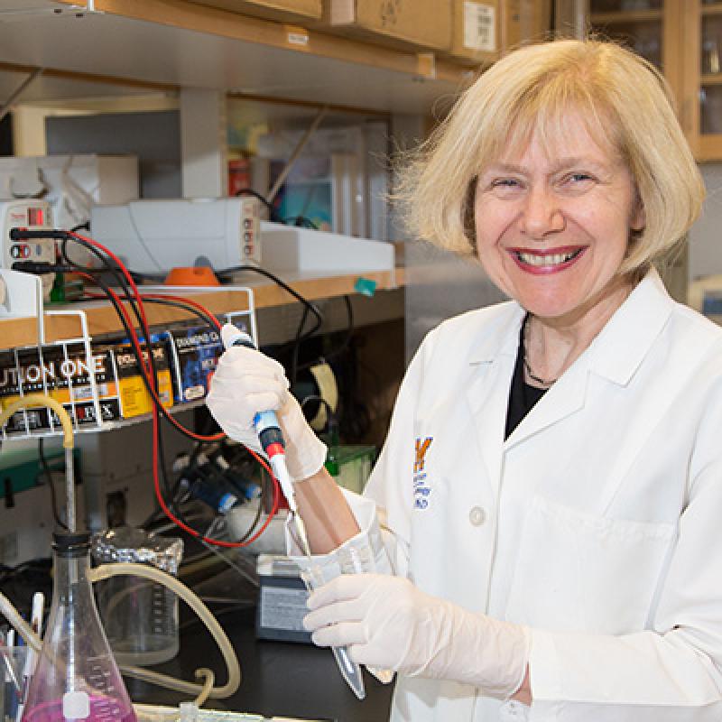 Eva Feldman, M.D., Ph.D., in lab