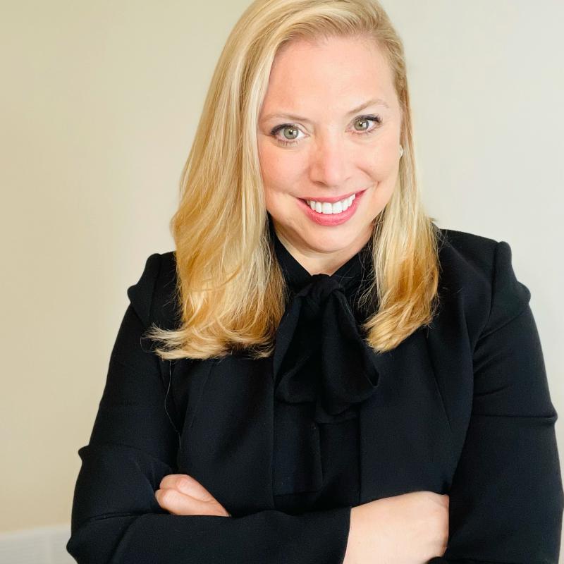 Picture of researcher, medium blond hair, in black suit jacket with the words:    Lisa M. Meeks, PhD, MA