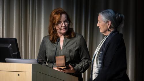 Edith Briskin receiving an award for her contributions from Dawn Kleindorfer, M.D.