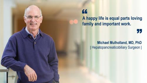 Dr. Michael Mulholland standing in a hallway and his #WeAreUmichSurgery quote