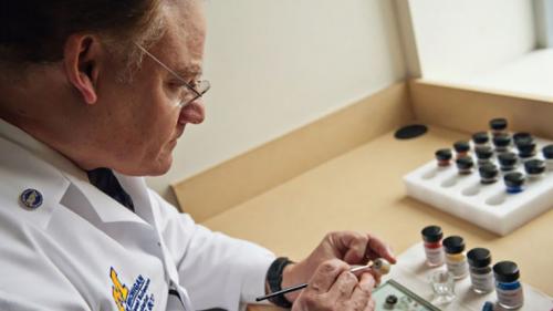 Ocularist Greg Dootz crafting an prosthetic eye