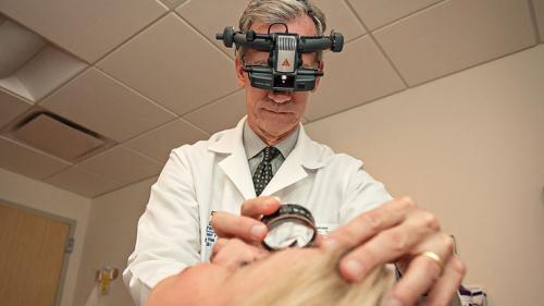 Dr. Mark Johnson examining a patient