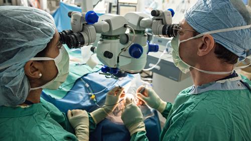 Dr. David Zacks performing surgery in an OR at the Kellogg Eye Center