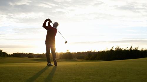 photo of a man golfing